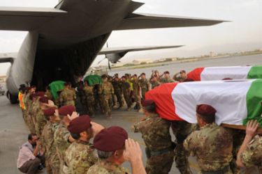 Italian soldiers salute the coffins bearing the bodies of Italian soldiers of the NATO-led International Security Assistance Force (ISAF) killed in the deadliest suicide attack targeting