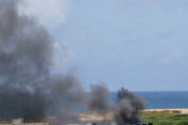 Black smoke rises from inside the AMISOM base in Mogadishu after two powerful explosions ripped through the African Union peacekeepers force commander building
