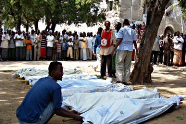 afp : A Somali man fixes a sheet covering on September 12, 2009, a stretcher with the body of one of the six people that were killed by a stray mortar shell fired by extremist