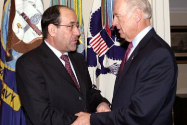 U.S. Vice President Joe Biden (R) welcomes Iraq's Prime Minister Nuri al-Maliki (L) during a visit to the White House in Washington October 19, 2009.