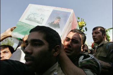 f/Iranians carry the coffin of Rajabali Mohammadzadeh, a commander of the Revolutionary Guards ground forces, killed two days ago, near the Pakistani border, during a funeral in Tehran outside the Revolutionary Guard garrison on October 20, 2009.