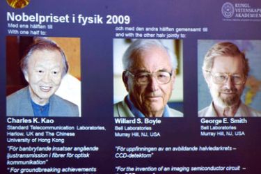 Photo taken on October 6, 2009 shows file portraits of (from L) Britain's Charles Kao, Willard Boyle and George Smith of the US, winners of the 2009 Physics Nobel Prize winners projected during the announcement at the Royal Academy of Sciences in Stockholm, Sweden.