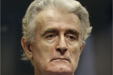 (FILES) In this file picture taken on July 31, 2008 Former Bosnian Serb leader Radovan Karadzic is pictured in the court room of the International Criminal Tribunal for the Former Yugoslavia at the start of his initial appearance in The Hague. The genocide trial of Bosnian Serb wartime leader Radovan Karadzic was adjourned in his absence October 26 to 27 afternoon for the prosecution to present its opening statement. AFP PHOTO / FILES