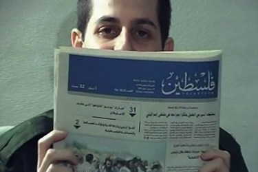 A grab of a video released on October 02, 2009 by Israeli authorities to media, shows captured Israeli soldier Gilad Shalit holding up a Gaza newspaper dated