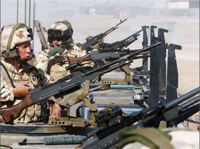 (FILES) Australian soldiers of the NATO-led International Security Assistance Force (ISAF) keep guard on top of armored vehicles, in Tirin Kot, the capital of Uruzgan province, on February 17, 2007