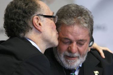 Rio de Janeiro 2016 President Carlos Nuzman kisses President Luis Inacio Lula da Silva of Brazil (R) during a news conference following the signing of the host city
