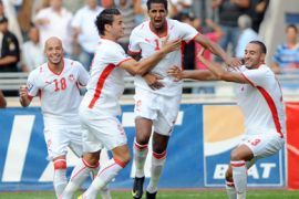 (L to R) Tunisia's Yassine Mikari, Khaled Korbi, Issam Jomaa and Nabil Tayder celebrate after scoring against Kenya during their 2010 World Cup-African Nations Cup qualifying