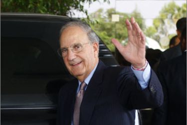US Middle East envoy George Mitchell waves to the press as he leaves following a meeting with Egyptian Foreign Minister Ahmed Abul Gheit in Cairo on October 11, 2009