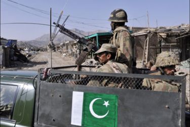 afp : Pakistani soldiers patrol in Sararogha town, which was stronghold of Taliban militants in troubled South Waziristan, on November 17, 2009. Pakistan said on November 17 that