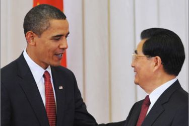 US President Barack Obama shakes hands with Chinese President Hu Jintao (R) following a statement to the press at the Great Hall of the People in Beijing on November 17, 2009