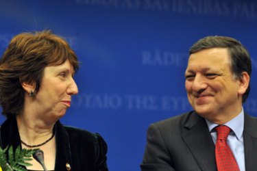 British Catherine Ashton, chosen as EU foreign policy chief smiles next to European Commission President Jose Manuel Barroso during a family photo at the European Council headquarters on November 19, 2009 in Brussels.
