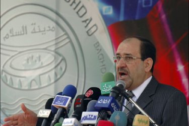 r : Iraq's Prime Minister Nuri al-Maliki speaks during an annual celebration marking Baghdad Day at al-Zawraa park in Baghdad, November 15, 2009. REUTERS/Ahmed Malik