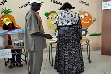 A woman casts her vote at a polling station in an informal settlement called Thomas Heinyeko, outside Windhoek, on November 28, 2009. Polling stations in Namibia opened on