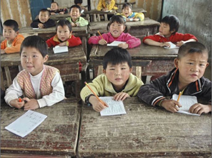 Students attend class at a rural primary school in Sheqi county, Henan province, November 3, 2009.