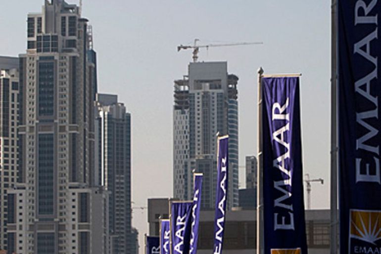 Flags for property company EMAAR, builders of Burj Dubai the world's tallest tower, are seen in Dubai, November 27, 2009. Credit ratings agency Moody's on Wednesday