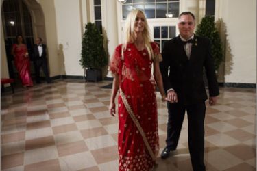 : This November 24, 2009 photo shows Tareq Salahi (R) and Michaele Salahi arriving for the State Dinner in honour of India's Prime Minister Manmohan Singh at the Bookseller's area of the White House in Washington, DC
