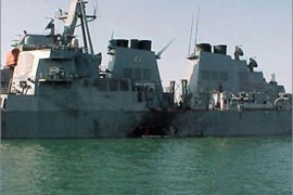 DECADE IN PICTURESThis photo dated 12 October 2000 shows the damaged port side of the guided missile destroyer USS Cole after an attack balmed