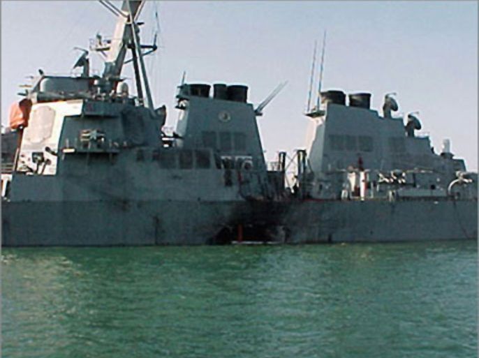 DECADE IN PICTURESThis photo dated 12 October 2000 shows the damaged port side of the guided missile destroyer USS Cole after an attack balmed