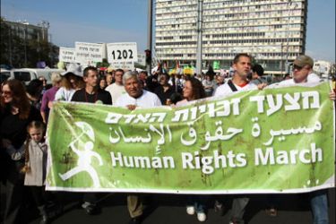 afp : Thousands of social activists march in Tel Aviv in a procession marking International Human Rights Day on Decemeber 11, 2009. Jewish and Arab Israeli protesters