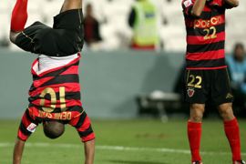 South Korean Pohang Steelers' Denilson Martins Nascimento (L) celebrates with teammate No Byung-Jun after scoring a goal against Congolese TP Mazembe during their 2009 FIFA Club World Cup quarter-final football match at the Mohammed bin Zayed Stadium in Abu Dhabi on December 11, 2009. Pohang Steelers won 2-1. AFP