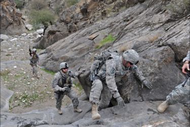 US soldiers from the Provincial Reconstruction team (PRT) Steel Warriors patrol in the mountains of Nuristan Province on December 19, 2009.