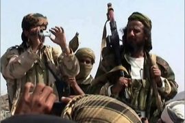 Men claiming to be Al-Qaeda members arrive to address a crowd gathered in Yemen's southern province of Abyan on December 22, 2009.