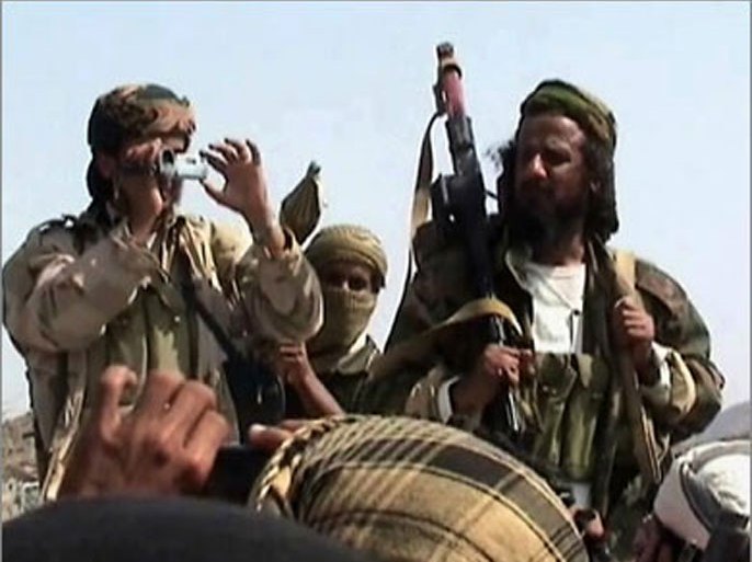 Men claiming to be Al-Qaeda members arrive to address a crowd gathered in Yemen's southern province of Abyan on December 22, 2009.