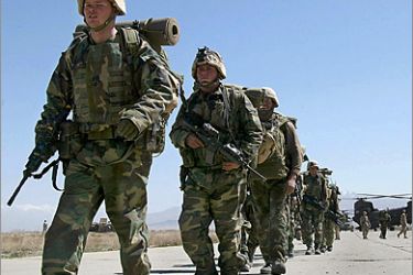 AFP(FILES) This file photo taken on March 12, 2002 shows US soldiers arriving at Bagram air base, north of Kabul. US President Barack Obama on December 1, 2009 warned