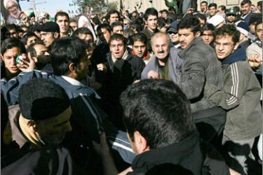 A picture taken on December 21, 2009 shows Iranian opposition supporters and supporters of supreme leader Ayatollah Ali Khamenei clashing during the funeral of Iranian cleric Grand Ayatollah Hossein Ali Montazeri in the holy city of Qom. Iran police clashed with mourners at a memorial service for Montazeri in
