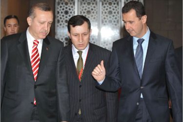 A handout picture released by the official Syrian news agency SANA shows Syrian President Bashar al-Assad (R) and Turkish Premier Recep Tayyip Erdogan before a press conference in Damascus on December 23, 2009. Erdogan hailed Turkey's fast expanding relations with Syria as model for its ties with other Arab countries