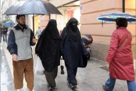 Two veiled muslim women walk down a street in Marseille, southern France, on December 24, 2009. French President Nicolas Sarkozy's ruling party