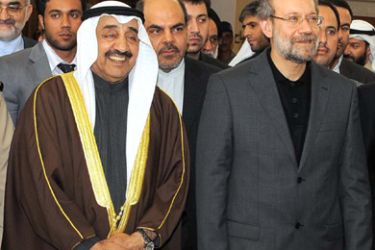 f-Kuwaiti Parliament Speaker Jassem al-Khorafi (L) gives a tour of Kuwait's national assembly headquarters to his Iranian counterpart Ali Larijani in Kuwait City on January 26, 2010.