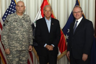 U.S. Vice President Joe Biden (C) poses for the media with top U.S. military commander in Iraq General Raymond Odierno (L) and U.S. Ambassador Chris Hill at the U.S. Embassy in Baghdad January 22, 2010. REUTERS