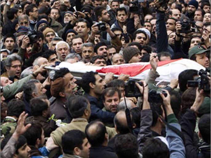Mourners carry the body of Tehran University professor Massoud Ali-Mohammadi in northern Tehran January 14, 2010. A remote-controlled bomb killed the University scientist