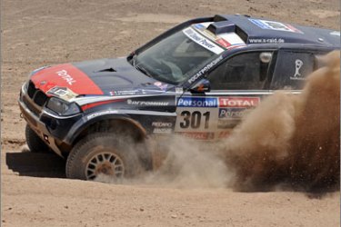 France's Stephane Peterhansel steers his BMW during the 5th stage of the Dakar 2010 between Copiapo and Antofagasta, Chile, on January 6, 2010. US Mark Miller won the stage, Spain's Carlos Sainz took the second place and leads the race, and Qatar's Nasser Al-Attiyah the third.