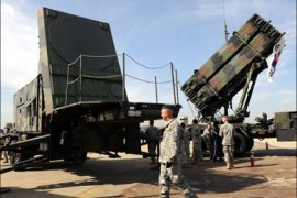 afp : (FILES) A US soldier walks past the launcher of a Patriot missile PAC-3 system during the Air Power Day at the US airbase in Osan, south of Seoul in this October 11,