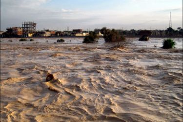 afp : Flood waters cover an area in the Egyptian port town of El-Arish, 45 kms (30 miles) from the Gaza border, on January 18, 2010. At least seven people died in flash floods