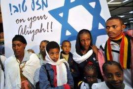afp : Newly-arrived Jewish immigrants from Ethiopia are seen in Israel's Ben Gurion airport overnight on January 19, 2010. Eighty-one Ethiopian Jews were flown to Israel by the