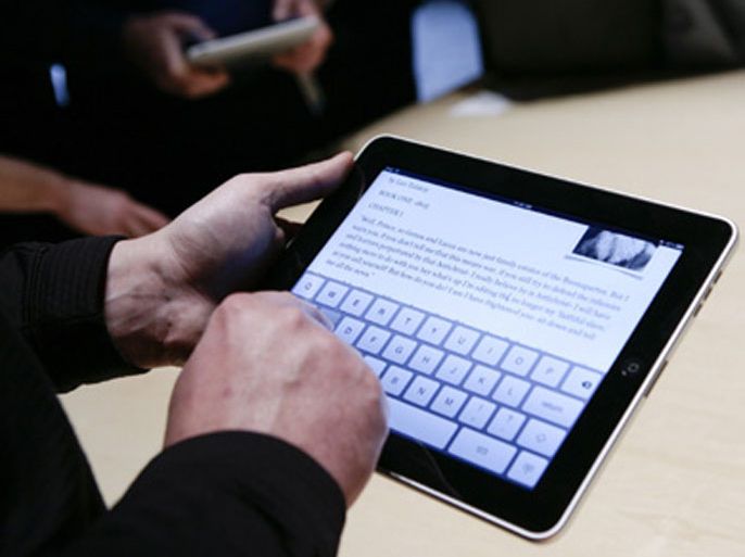 Event guests play with the new Apple iPad during an Apple Special Event at Yerba Buena Center for the Arts January 27, 2010 in San Francisco, California. CEO Steve Jobs and Apple Inc. introduced its latest creation, the iPad, a mobile tablet browsing device that is a cross between the iPhone and a MacBook laptop.