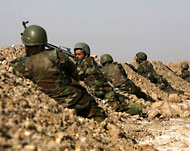 قوات أفغانية تشارك في تطويق قرية مرجا (الفرنسية)