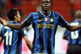 epa : 01466039 talian Mario Balotelli of Inter Mila reacts after scoring a goal against As Roma during their Italian SuperCup final soccer match at Meazza stadium in Milan, Italy on 24