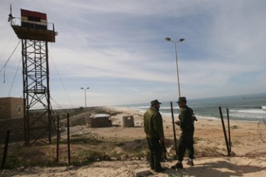 Palestinian Hamas security men stand on the beach at the border with Egypt in the southern Gaza Strip town of Rafah on February 10, 2010. Egyptians are installing underground metal sheets along the border area of Rafah with Egypt's in a bid to stem smuggling into Hamas-ruled Gaza, residents and officials have said.