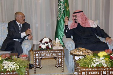 r_Saudi Arabia's King Abdullah (R) meets Yemeni President Ali Abdullah Saleh on his arrival in Riyadh February 23, 2010. REUTERS/Saudi Press Agency/Handout