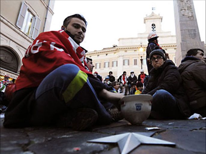 r_Alcoa Industry workers take part in a sit-in protest in front of Palazzo Montecitorio in downtown Rome February 2, 2010. Hundreds of Alcoa workers marched through Rome