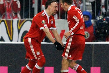 f_Bayern Munich's French midfielder Franck Ribery (L) celebrates scoring with Bayern Munich's defender Philipp Lahm during the DFB German Cup quarter final football
