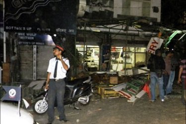 r : A view of a damaged bakery shop after a blast in Pune February 13, 2010. At least eight people were killed in a suspected bomb blast at a restaurant popular with foreign