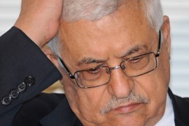Palestinian president Mahmud Abbas places his hand on his head as he listens to a question following his speech at the Japan National Press Club in Tokyo on February 9, 2010.
