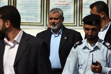 f_Hamas leader in the Gaza Strip Ismail Haniya arrives at the parliament in Gaza City on February 23, 2010 to attend a protest against Israel's plan to restore two flashpoint