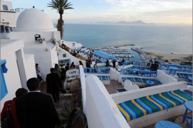 A picture taken on February 22, 2010 shows tourists and residents arriving at the "Cafe des Delices"in the village of Sidi Bou Said, overlooking the Tunisian golf. Sidi Bou Said, which has become the most visited village in Tunisia