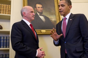 This official White House photograph shows US President Barack Obama (R) meeting with Prime Minister George Papandreou (L) of Greece before a portrait of 16th US